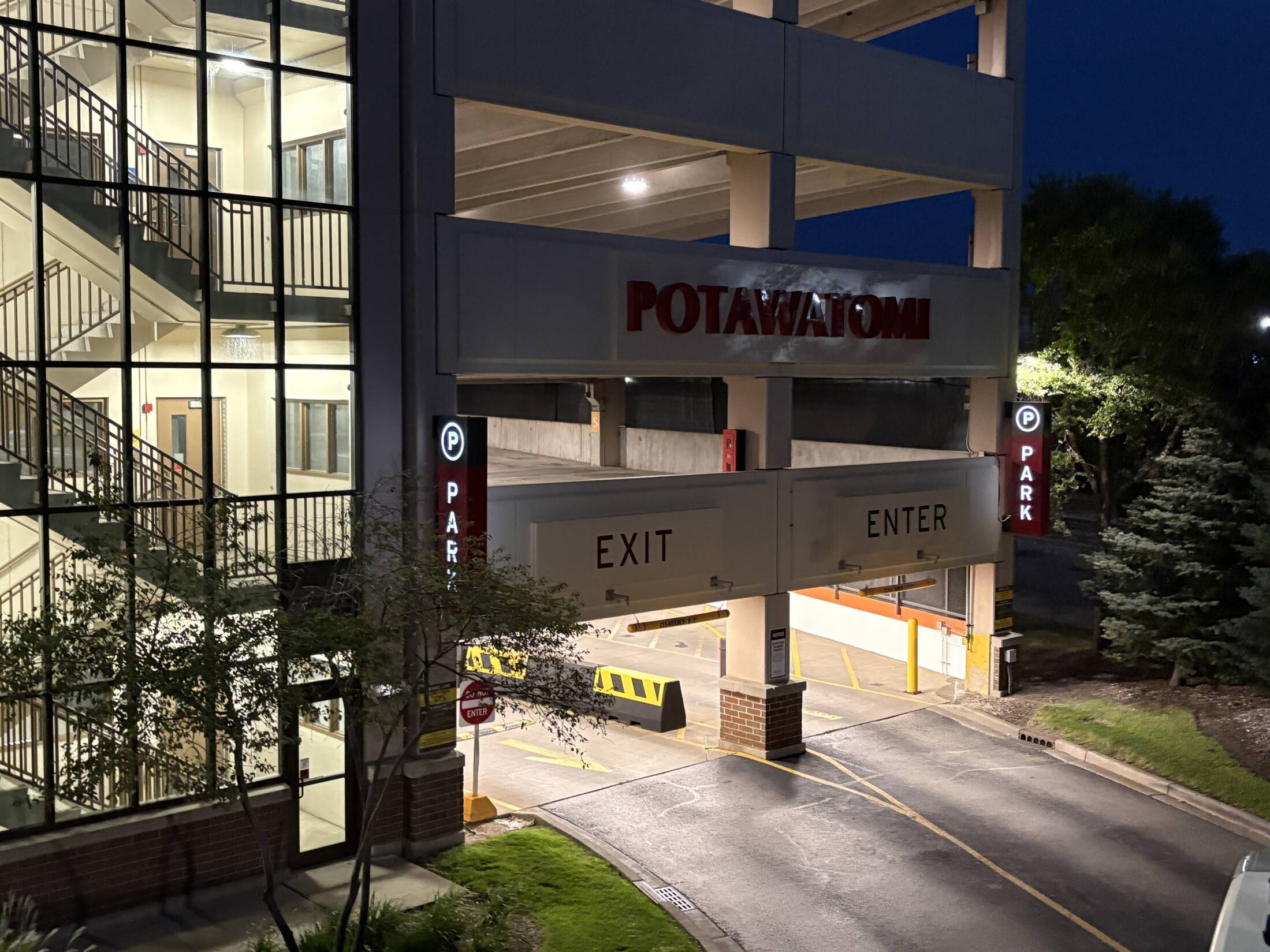 signs at the Potawatomi parking garage at dusk